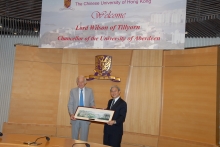 Prof. Pak-wai Liu presented a campus portrait to Lord Wilson.