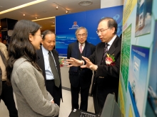 The Commissioner for Innovation and Technology, Mr Eddy Chan Yuk Tak, views students' projects with the company of Vice-Chancellor, Prof. Lawrence J. Lau and Pro-Vice-Chancellor, Prof. Jack Cheng.