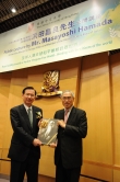 Prof Lawrence J. Lau presents the book Master of Cursive Calligraphy: Yu Youren to Mr Masayoshi Hamada (left) as a souvenir