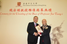 Professor Lawrence J. Lau presents to Professor Jao a photo of his bust as a souvenir