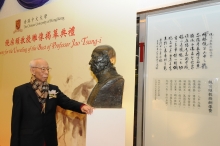 Professor Jao and his bronze bust, behind which is the commendation autographed by Professor Richard Ho