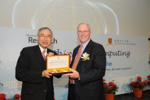 Prof Lawrence J Lau, Vice-Chancellor, CUHK (left) presents a souvenir to Mr Craig Mundie
