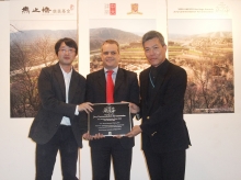 Dr Tim Curtis, Head of Culture Unit, UNESCO Bangkok (middle) presents the Jury Commendation for Innovation at the 2009 UNESCO Asia-Pacific Heritage Awards for Culture Heritage Conservation to Prof. Edward Ng (right) and Mr. Mu Jun, Ph.D student, School of Architecture, CUHK (left)