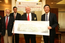 Prof. Joseph Sung (right) presents a souvenir to Prof. Chubb (2nd right)