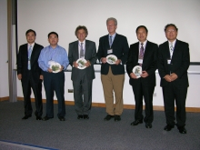 Prof. Lin Hui (1st right) and Prof. Chen Jinsong (1st left) of ISEIS present souvenirs to keynote speakers: (2nd to 5th from left) Prof. Wu Bingfang, Institute of Remote Sensing Application, CAS; Prof. Chlris Justice, University of Maryland; Mr. Cornelis Anthonius van Diepen, Wageningen University – Alterra Netherlands; and Prof. Guo Huadong, Center for Earth Observation and Digital Earth, CAS