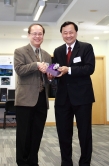 Prof. Benjamin W. Wah (right), Provost of CUHK, presents a souvenir to the keynote speaker Prof. William Lau, NASA Goddard Space Flight Center, USA