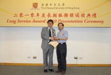 CUHK Vice-Chancellor Prof. Joseph J.Y. Sung presents a certificate and a gold lapel pin to Prof. Joseph Chan