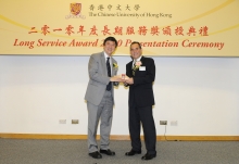 CUHK Vice-Chancellor Prof. Joseph J.Y. Sung presents a certificate and a gold lapel pin to Prof. Andrew van Hasselt