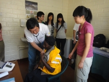 Prof. Joseph J.Y. Sung leads the medical students to do physical check-up and make diagnosis for the locals.