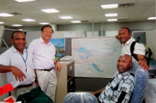 Prof. Lin Hui (second left) meets with land planning officers in PNG to share the importance of satellite remote sensing.