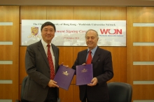 CUHK Vice-Chancellor and President Prof. Joseph Sung (left) and Chief Executive Officer of WUN Prof. John Hearn (right) sign the Heads of Agreement for the University's admission into the Network.