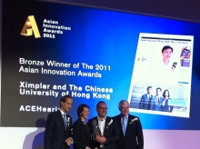 Professor Andrew van Hasselt (2nd right) receiving the bronze award from  Sir John Major, the former British Prime Minister (1st right)