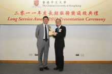 CUHK Vice-Chancellor Prof. Joseph J.Y. Sung presents a certificate and a gold lapel pin to Prof. Fok Tai-fai