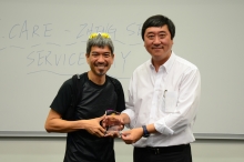 Prof. Joseph Sung, Vice-Chancellor of CUHK, presents a souvenir to Dr. Chan Siu Cheuk, Principal of Zheng Sheng College.