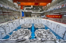 Four antineutrino detectors submerged in pure water in the Daya Bay Far Hall, each being 5m in height and diameter, all in place in September 2012. The Hong Kong team designed and built a subsystem in each of the detectors.