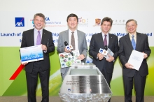 (From left to right) Stuart Harrison, Professor Joseph J.Y. Sung, Henri de Castries and Professor Gabriel Ngar-Cheung Lau, seal the time capsule which stored the environmental aspirations from AXA Hong Kong staff members, CUHK students and green ambassadors, and themselves.