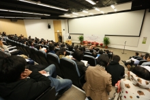 The lecture receives a full house of about 300 audiences.