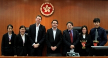 Prof. Michael Ramsden (4th left) and Prof. Luke Marsh (3rd left), Faculty of Law, take a photo with the winners of The CUHK Moot Cup: champions were Christy Lau (2nd right) and Joshua Hung (1st right) of the Chinese International School who prevail in a close final against Adriana Lee (2nd left) and Vanessa Ma (1st left) of Diocesan Girls' School.