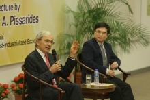 Prof. Christopher Pissarides and Prof. Zhang Junsen, Chairman, Department of Economics, CUHK (right) interact with audience in the Q&A session.