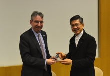 Prof. Eng-Kiong Yeoh (right), Director of the Jockey Club School of Public Health and Primary Care, CUHK presents a souvenir to Mr. Duncan Selbie, Chief Executive of Public Health England.