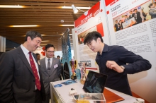 Prof. Joseph Sung and guests visit the exhibition booths.