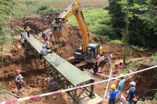 The volunteers complete the construction of the bridge in only 9 days.