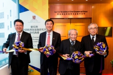 Officiating guests perform the ribbon cutting ceremony of the Lau Chor Tak Institute of Global Economics and Finance. (From left) Prof. Terence Chong, Prof. Joseph Sung, Mr. Lau Chor-tak, and Prof. Lawrence Lau.