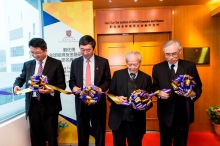 Officiating guests perform the ribbon cutting ceremony of the Lau Chor Tak Institute of Global Economics and Finance. (From left) Prof. Terence Chong, Prof. Joseph Sung, Mr. Lau Chor-tak, and Prof. Lawrence Lau.