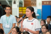 A member of the audience shares her views at the question and answer session.