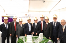 Guests stand near a scale model of The CUHK Medical Centre.