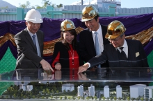 Officiating guests have a look at the model of the hostels.