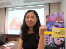 Prof. Ni Zhao shows a novel blood pressure sensor on the back of her hand.