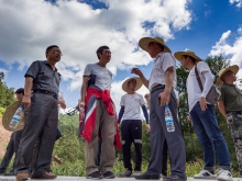 Prof. Joseph Sung (2nd left) asks villagers about their living conditions.