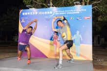 Mr. Daniel Lee (left), Lecturer of the Department of Sports Science and Physical Education, CUHK and Prof. Joseph Sung lead CUHK runners conduct warm up exercise