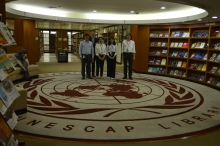 CUHK interns and their colleagues at the library of the UNESCAP.