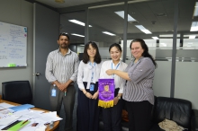 CUHK interns present CUHK flags as souvenir to the host sector at the UNESCAP.