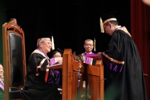 Dr. Norman N.P. Leung, Chairman of the Council, CUHK presents the Ordinance of CUHK to Professor Rocky S. Tuan.