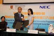 Prof. Alvin Leung Seung Ming (middle), Dean of Education at CUHK, and Ms. Elsa Wong (right), Managing Director of NECHK sign a MOU on robot for autism behavioural programme.