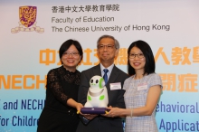 Prof. Alvin Leung Seung Ming (middle), Dean of Education at CUHK, and Ms. Elsa Wong (right), Managing Director of NECHK sign a MOU on robot for autism behavioural programme.