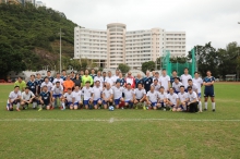 A group photo of the two teams.