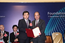 The Honorable Matthew Cheung (right), presents the Croucher Senior Research Fellowship 2019 to Prof. Qian Miao.