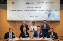 CUHK establishes partnerships with ETH Zurich, Imperial College London and Johns Hopkins University to deepen ties on transdisciplinary medical robotics research. (Back row) The event was witnessed by The Hon Mrs. Carrie LAM CHENG Yuet-ngor (centre), The Chief Executive of the HKSAR; Professor Rocky S. TUAN (left), Vice-Chancellor and President of CUHK; and Mr. Nicholas W. YANG, Secretary for Innovation and Technology of the HKSAR Government.