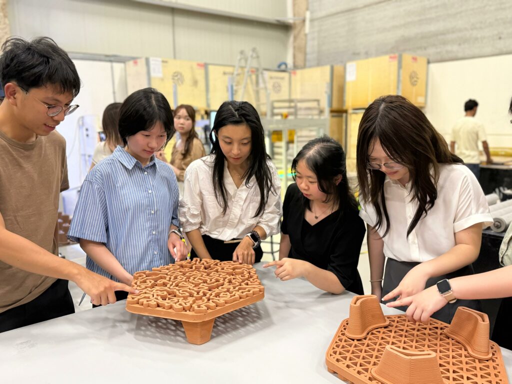 Students explore 3D-printed reef tiles at Archireef Eco-Engineering Facility in Abu Dhabi, learning restoration techniques to raise awareness for climate resilience.