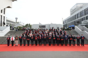 A group photo of all guests at the flag-raising ceremony.