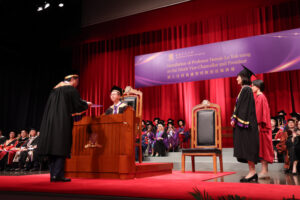Professor John Chai Yat-chiu, Chairman of the CUHK Council, presents the Ordinance of CUHK to Professor Dennis Lo Yuk-ming.