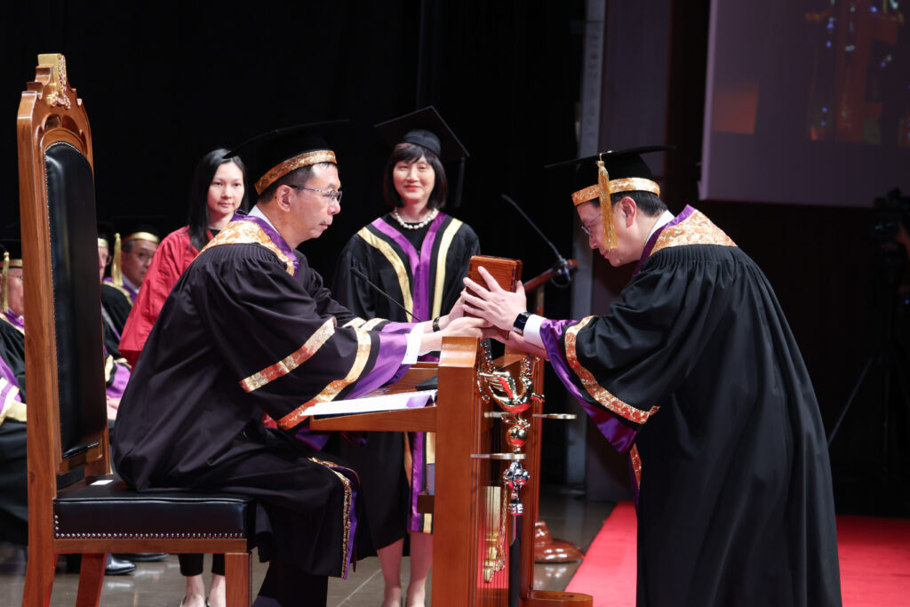 Professor John Chai Yat-chiu, Chairman of the CUHK Council, presents the Seal of the Vice-Chancellorship to Professor Dennis Lo Yuk-ming.