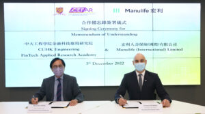 Professor Martin D F Wong, Dean of CUHK’s Faculty of Engineering (left) and Mr Anthony Buchanan, Chief Information Officer of Manulife Hong Kong and Macau, sign a Memorandum of Understanding (MOU).