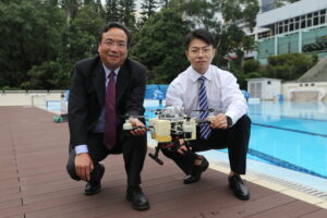 CUHK’s Department of Mechanical and Automation Engineering Professor Ben Chen (Left) and PHD student Liu Xuchen introduce the TJ-FlyingFish.