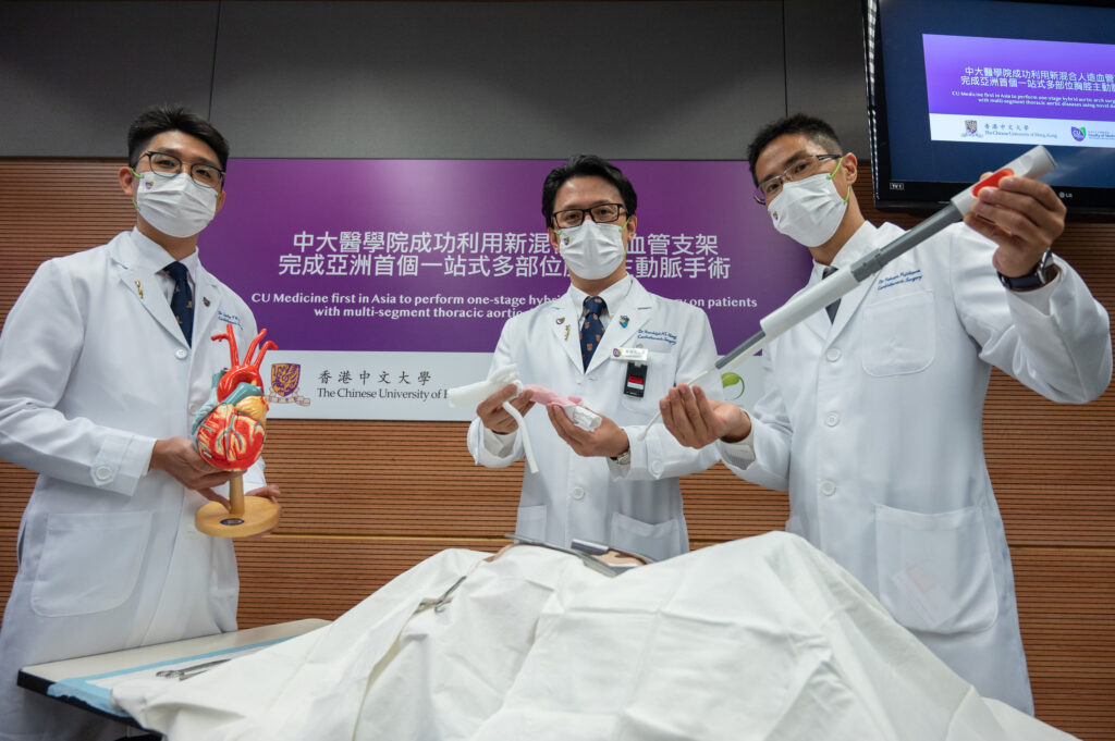 The Cardiothoracic Surgery team of CU Medicine has, for the first time in Asia, performed one-stage hybrid aortic arch surgery on patients with multi-segment aortic diseases using a new E-vita® OPEN NEO device. So far they have treated 25 patients and reported satisfactory outcomes.<br />
<br />
(From left) Clinical Assistant Professor (honorary) Dr Jacky Ho Yan-kit, Chief of Division Professor Randolph Wong Hung-leung and Clinical Assistant Professor (honorary) Dr Takuya Fujikawa, Division of Cardiothoracic Surgery, Department of Surgery, CU Medicine.