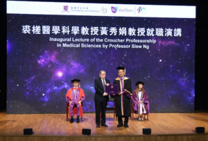 Professor Rocky Tuan delivers a token of thanks to Professor Cox.